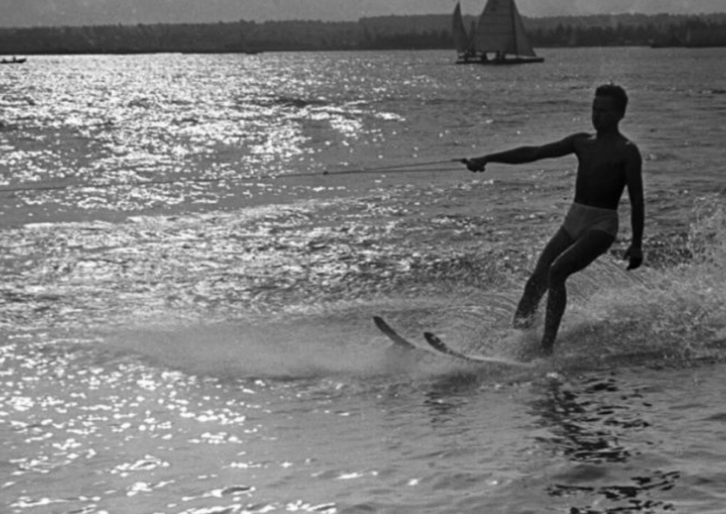 Man waterskiing on lake during Soviet summer